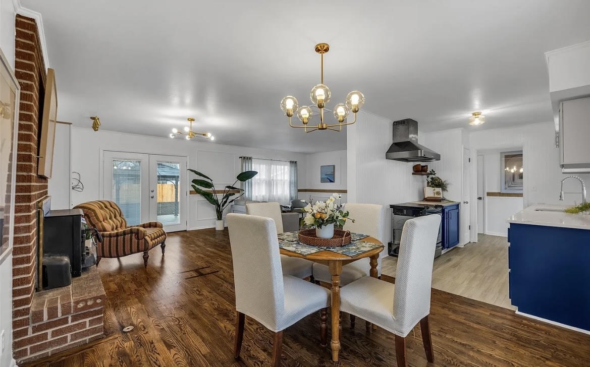 Open kitchen, dining, and living areas after coordinated whole-home improvements