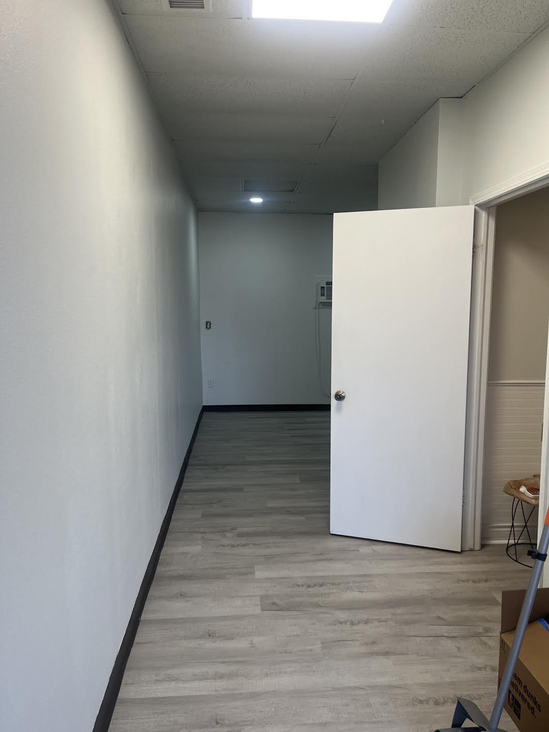 Commercial interior before the requested dark finish update